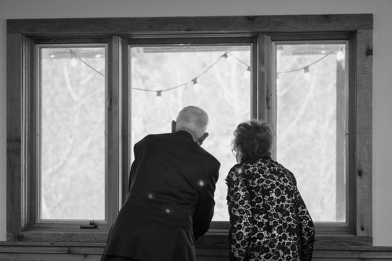 Jason and Amy kissing on the rocks framed by aspen trees